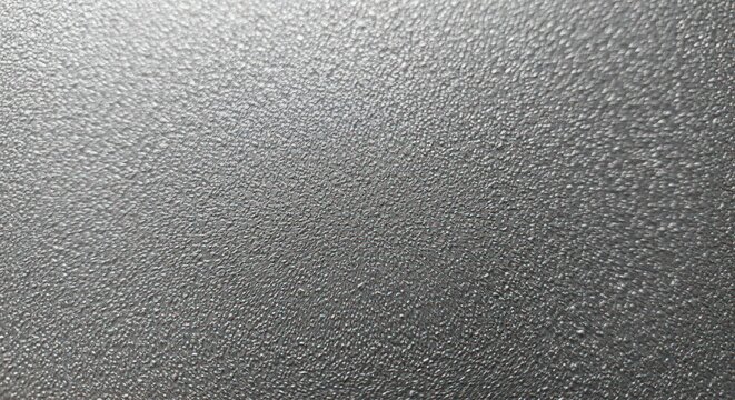 Detailed close-up of a black textured surface with small bumps
