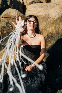 Young model showing ghost nets washed ashore on rocks
