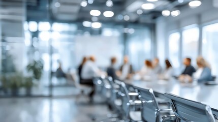 A diverse group of professionals engaged in a meeting within a modern, bright conference room.