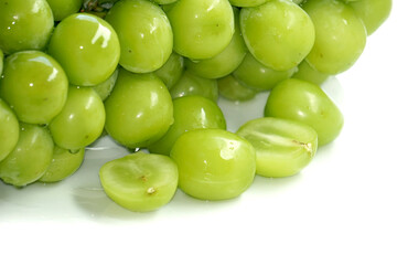 Fresh Bunches of shine muscat grapes green fresh grapes isolated on white background. Japanese grapes ripe juicy grapes.