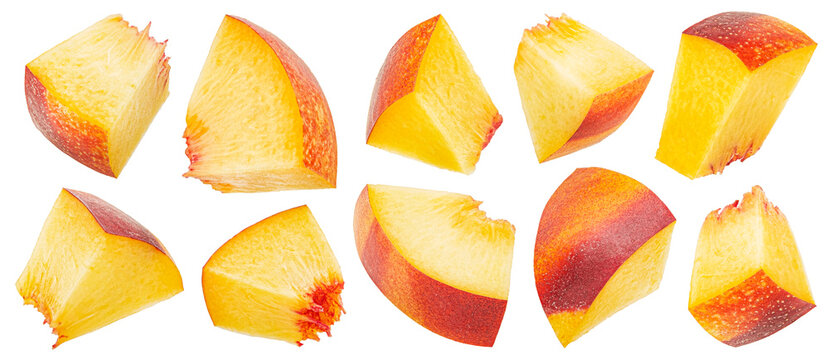 Peach slices isolated on white background with clipping path, falling nectarine cubes