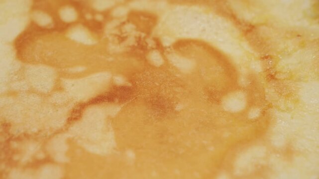 Crepes cooking on a hot pan. Crepe texture. High quality 4k footage