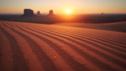 Naklejka premium Desert landscape at sunset with rippled sand dunes and rock formations