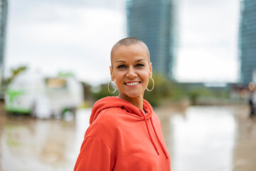 Mature woman with shaved hair in the city on a rainy day. Barcelona/??Spain
