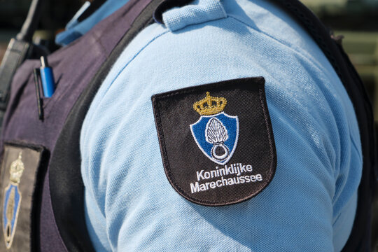 Closeup of a Koninklijke Marechaussee logo tag on the shoulder of a uniform. The Marechaussee is a dutch police organization with military status.