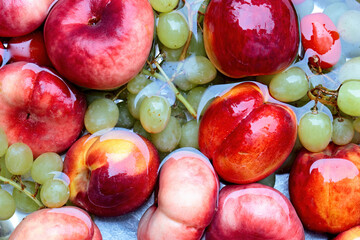 Red abd green fruits in water bowl