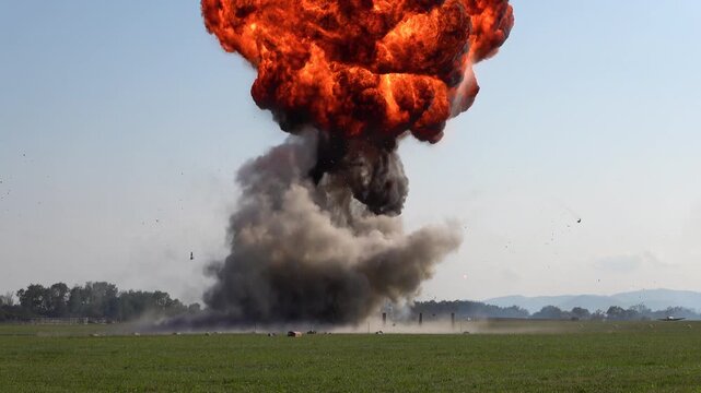 A demonstration of a retro aircraft from the Second World War attacking a ground target with an exploding effect