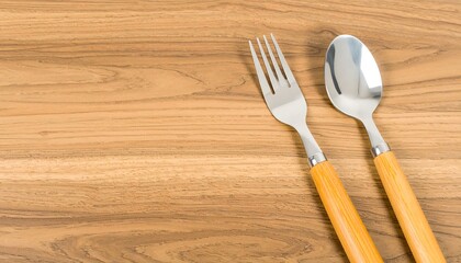 Fork and spoon on wood table
