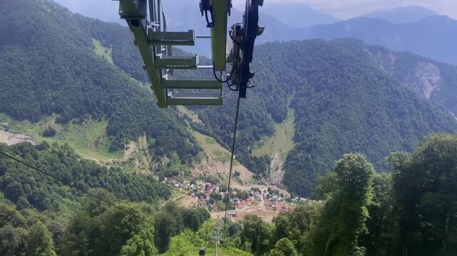 Tufandag Ski Resort cable car ride. Bird's-eye view of the peaks of the mountains and the green slopes of the Caucasus. Gabala, Azerbaijan in summer.