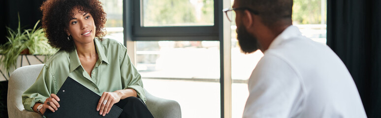 Job seekers engage in a dynamic interview within a contemporary office environment