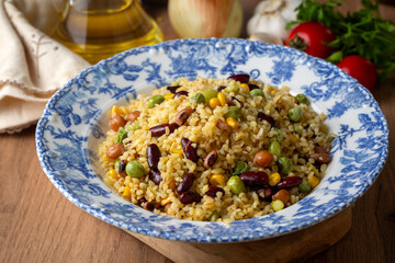 Bulgur pilaf with legumes; with peas, beans and corn kernels.