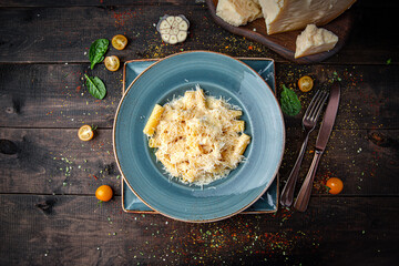 Fusilli quattro formaggi pasta served on a plate. Spiral pasta in creamy cheese sauce with rich Italian flavor and gourmet style.