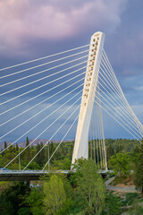 Podgorica, Montenegro - Augutst 25, 2025: Majestic Millennium bridge stretches over Moraca river in vibrant Podgorica, Montenegro