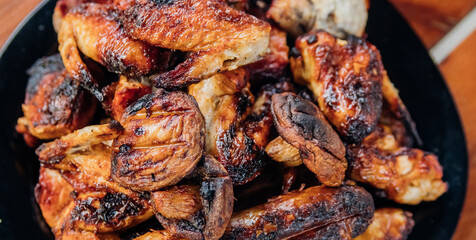 Assorted meat kebabs and mushrooms served on a plate are ideal for a diet.