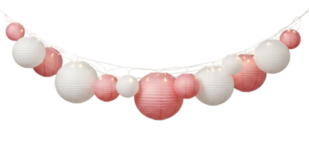 Delicate pink and white paper lanterns strung with warm fairy lights create a festive atmosphere