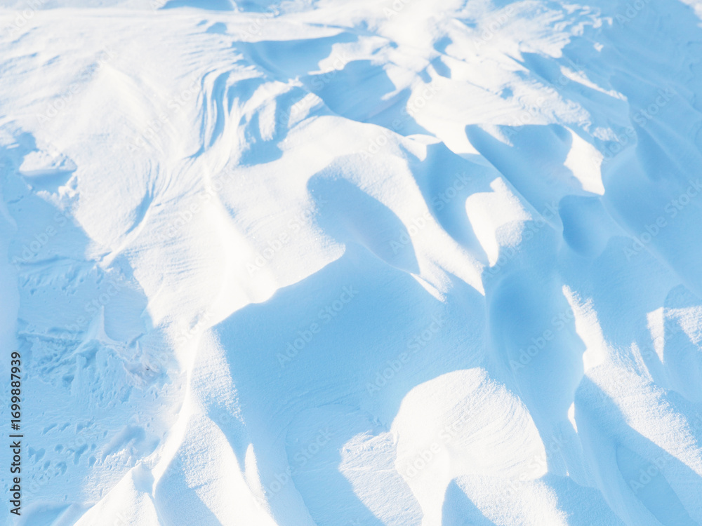 Sticker snow texture. wind sculpted patterns on snow surface. wind in the tundra and in the mountains on the