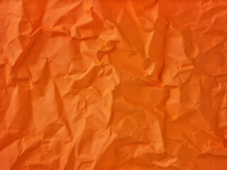 Fototapeta premium background of crumpled orange paper. Autumn abstract background. Element for design.
