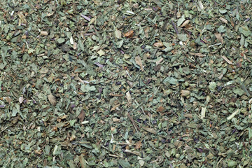 dried and chopped basil spice , food background