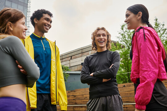 Young athletes enjoy a lively and friendly conversation during an outdoor practice session