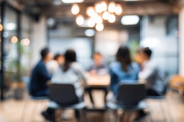Blur a group of employees are sitting in a meeting and listening to what their boss is saying about business in the organization in the small meeting room at the office in the morning. High quality