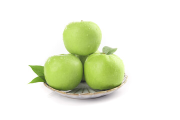 Fresh Green Shaanxi Apples on White Plate with Leaves - Sweet Crisp Fruit