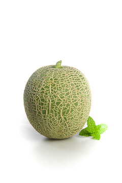Fresh Cantaloupe Melon with Mint on White Background