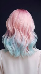 Naklejka premium Wavy pastel pink and blue ombre hairstyle from back view