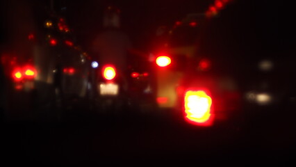  Blurred Red Taillights: Night Traffic on a Dark Road