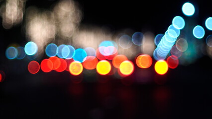 Vibrant City Night: Defocused Urban Lights Creating Bokeh Effect