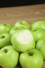 Fresh Green Apples from Shaanxi China with Water Drops on Wooden Background