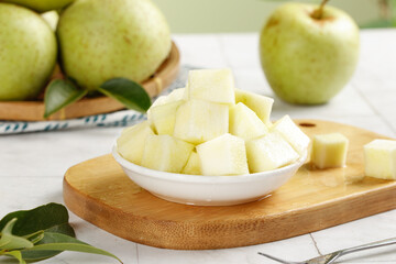 Fresh Green Shandong Apples Whole and Diced on Wooden Board - Healthy Fruit Preparation