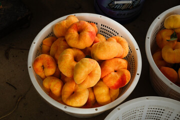 Fresh Golden Shandong Peaches and Nectarines in Baskets Ready for Packaging and Shipping