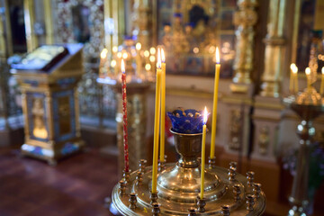 An Elegant Candle Holder featuring Lit Candles within a Beautiful and Serene Setting