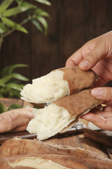 Roasted Sweet Potatoes with Creamy White Flesh Being Held in Hands