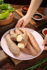 Fresh Sweet Potatoes on White Plate with Vegetables and Spices for Healthy Cooking