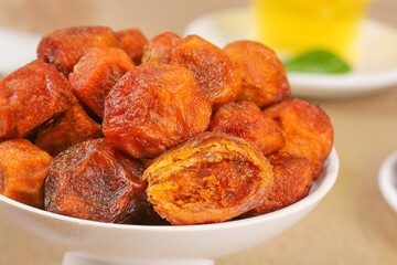 Dried Apricots from Xinjiang China in White Bowl - Healthy Dehydrated Fruit Snack