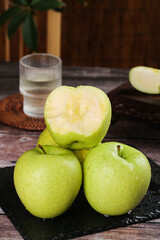 Fresh Green Apples on Slate Board - Healthy Organic Fruit with Water Drops on Rustic Wood Table