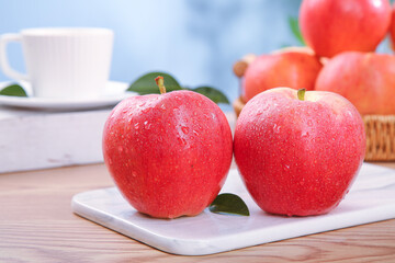 Fresh Red Fuji Apples with Water Droplets on Kitchen Counter