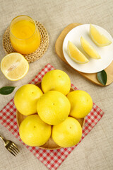 Fresh Yellow Citrus Fruits with Juice - Healthy Breakfast Table Setting