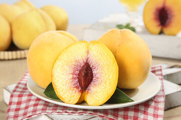 Fresh Yellow Peaches Cut in Half on Plate - Juicy Summer Fruit Display