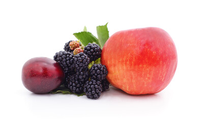 Red apple, purple plum and black blackberry isolated on white.