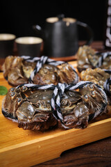 Fresh Yangcheng Lake Hairy Crabs Display on Wooden Board Chinese Seafood Delicacy