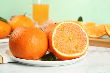 Fresh Orange Citrus Fruits with Juice Glass on White Plate in Natural Light