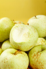 Fresh Green Apples from Shandong China with Water Droplets on Yellow Background