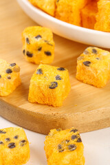 Passion Fruit Instant Tea Cubes with Seeds on Wooden Board - Tropical Beverage Preparation