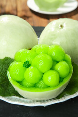 Fresh Jade Melon Balls in Natural Bowl with Mint - Asian Dessert