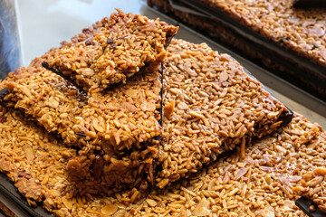 Close-up of traditional Florentine biscuit with almond, caramel, honey, and chocolate, stacked and ready to eat.