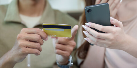 Travel. Online shopping with credit card and smartphone for vacation planning.