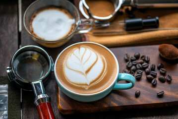 Barista Training Setup with Complete Latte Art Tools and Espresso Preparation Elements on Wooden Surface Coffee Tools Flat Lay: Organized Portafilter, Milk Jug, and Cups for Specialty Coffee.
