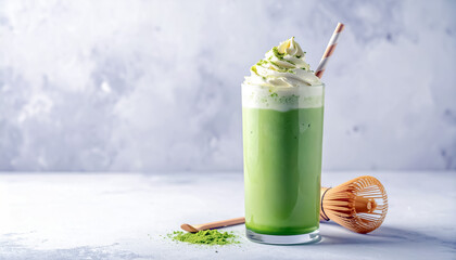 Matcha Shake Drink in Frosted Glass with Whipped Cream Topping and Straw